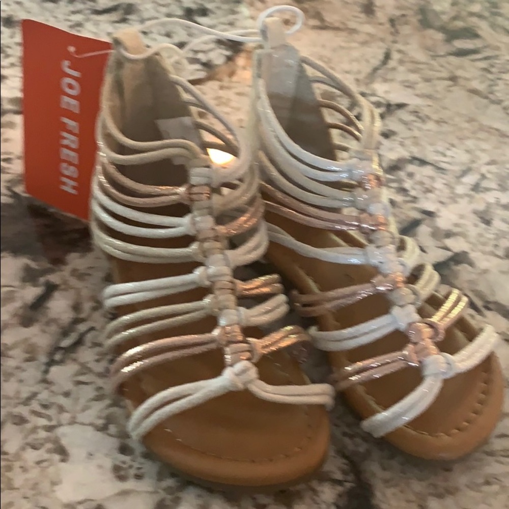 Girl sandals brand new never worn.